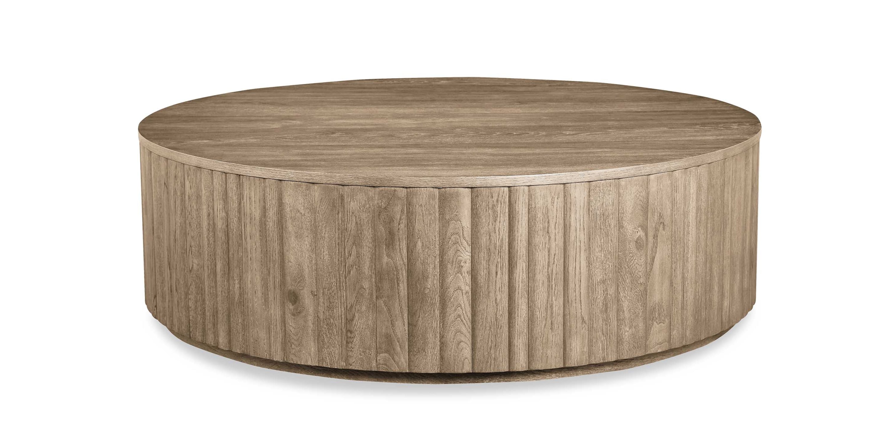 Round plinth cocktail table in wood grain finish.