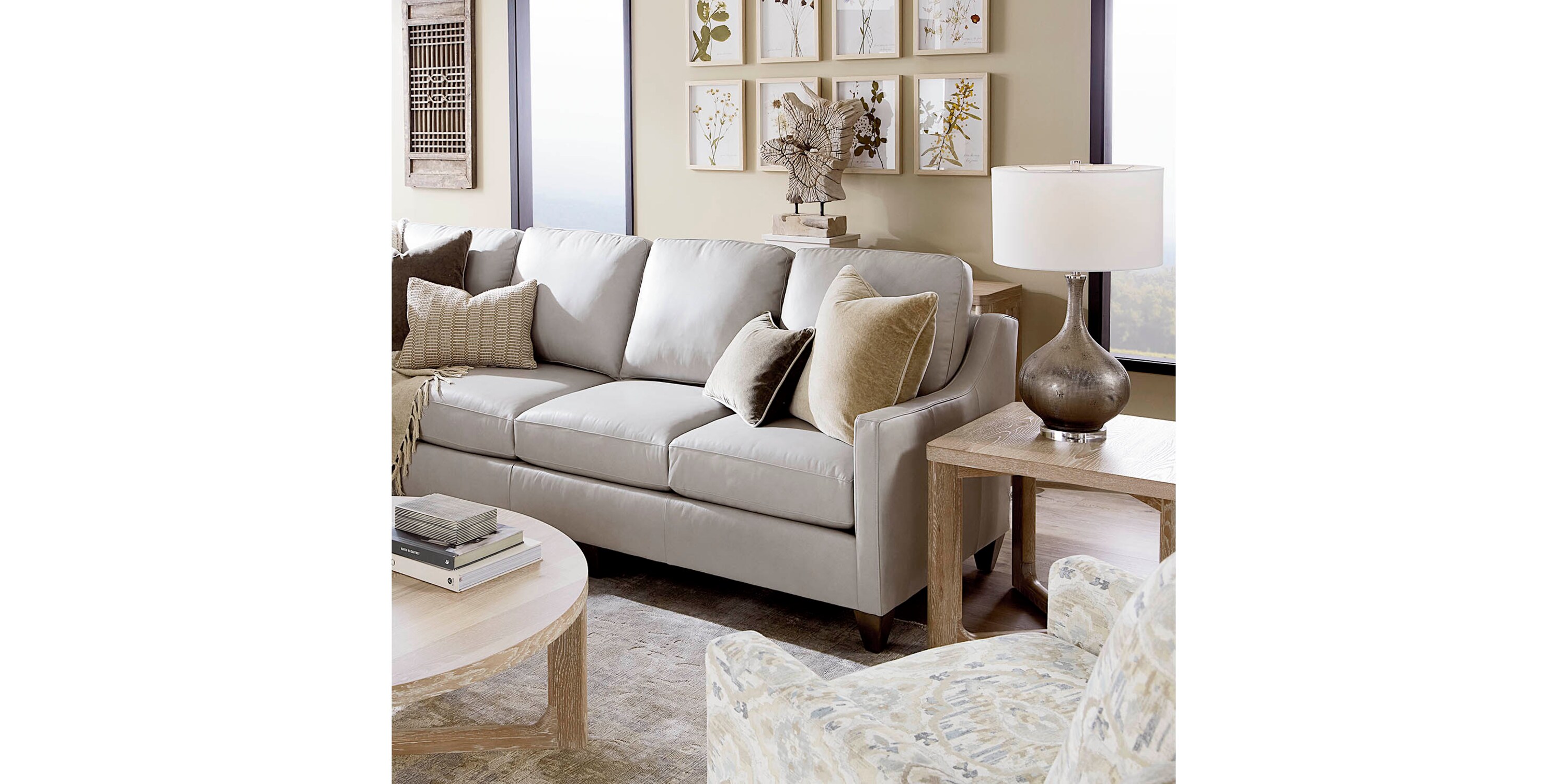 Beige fabric L-shaped sectional sofa in a living room.